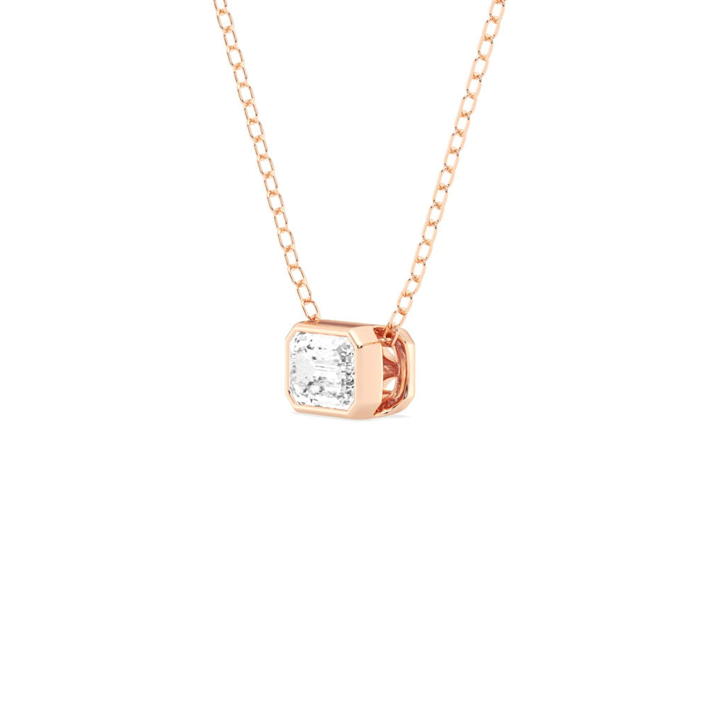 Side view of Puro Emerald Solitaire Diamond Pendant with rose gold chain.