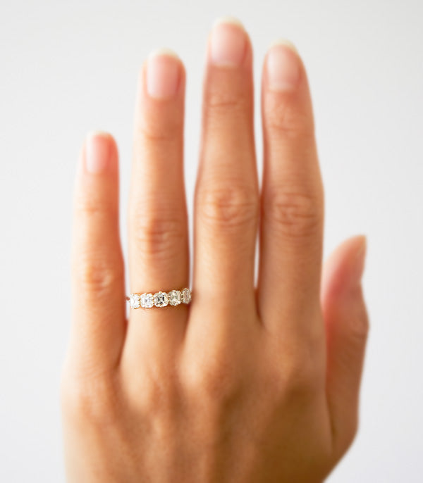 Puro Asscher Cut Diamond Band in yellow gold on model.