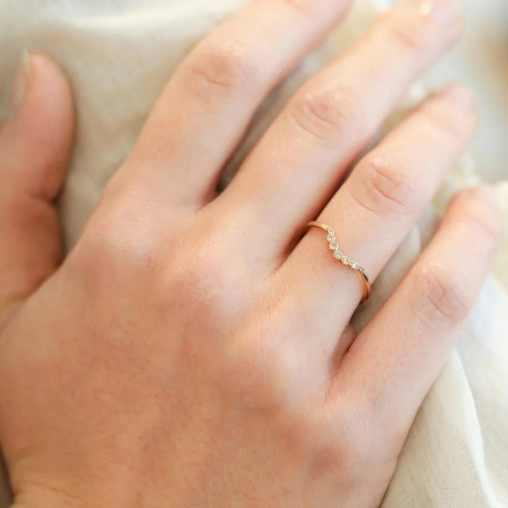 Puro Curved Lunar Diamond Milgrain in yellow gold on model.