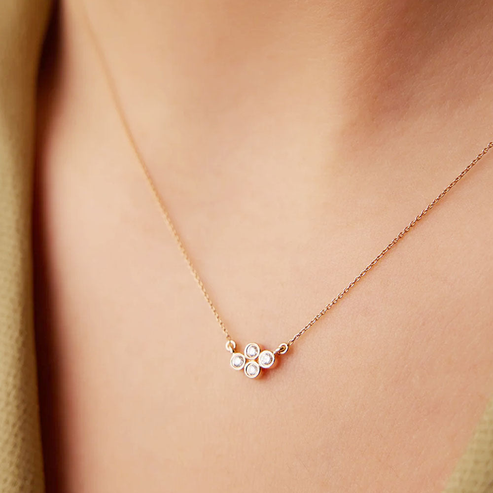 Puro Cluster Diamond Bezel Pendant with rose gold chain on model.