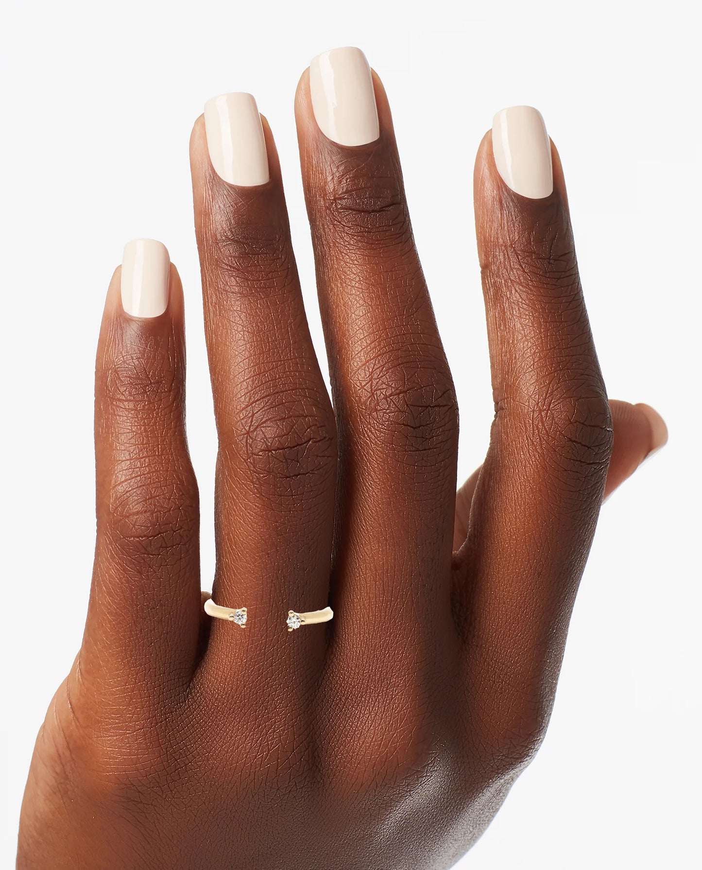 Puro Adjustable Open Diamond Band in yellow gold on model.